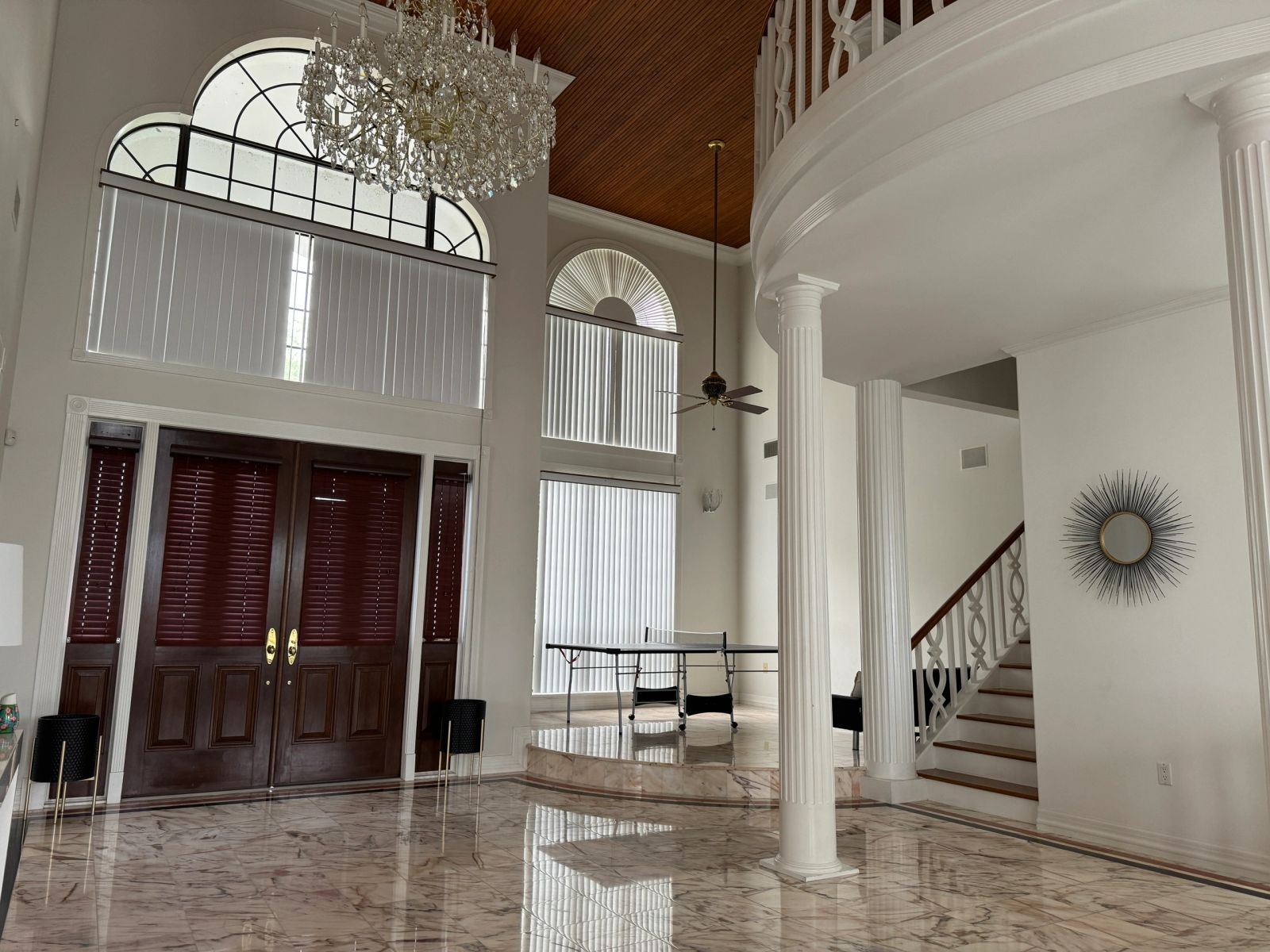 Front entrance with palms and pavers